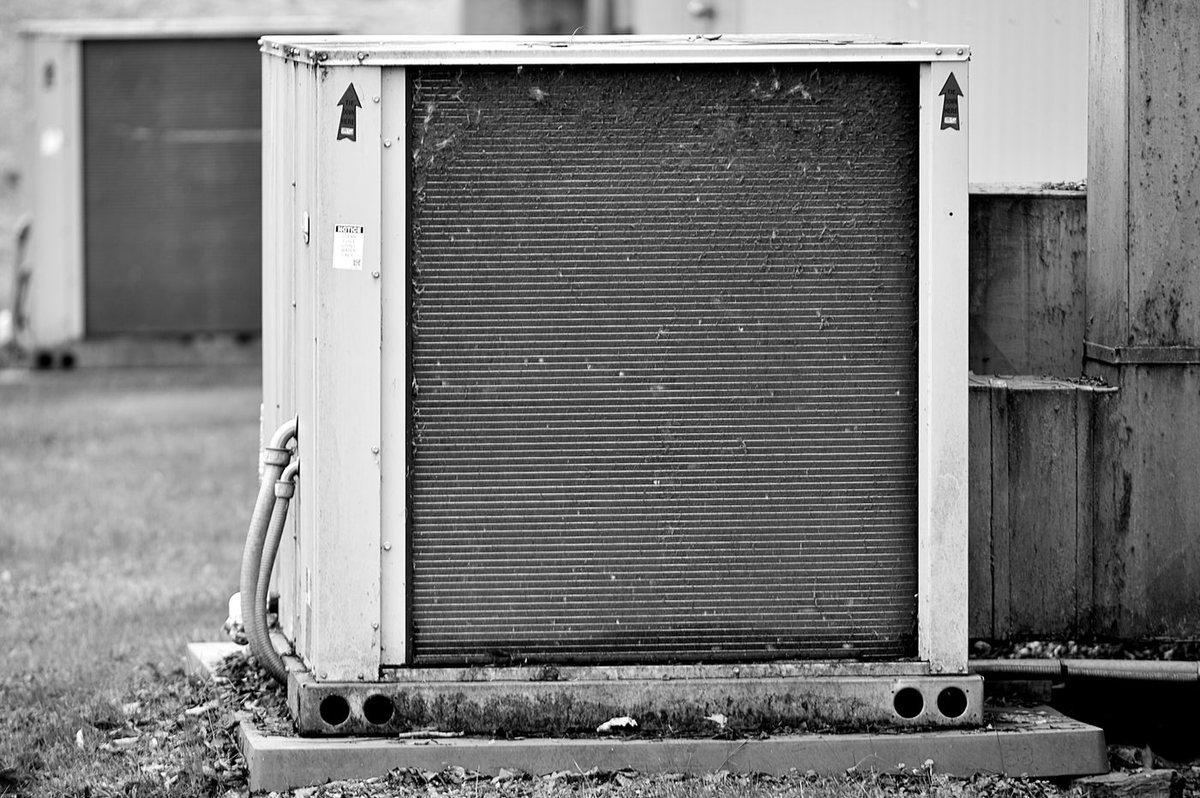 Close-up of an air conditioner coil and refrigerant lines