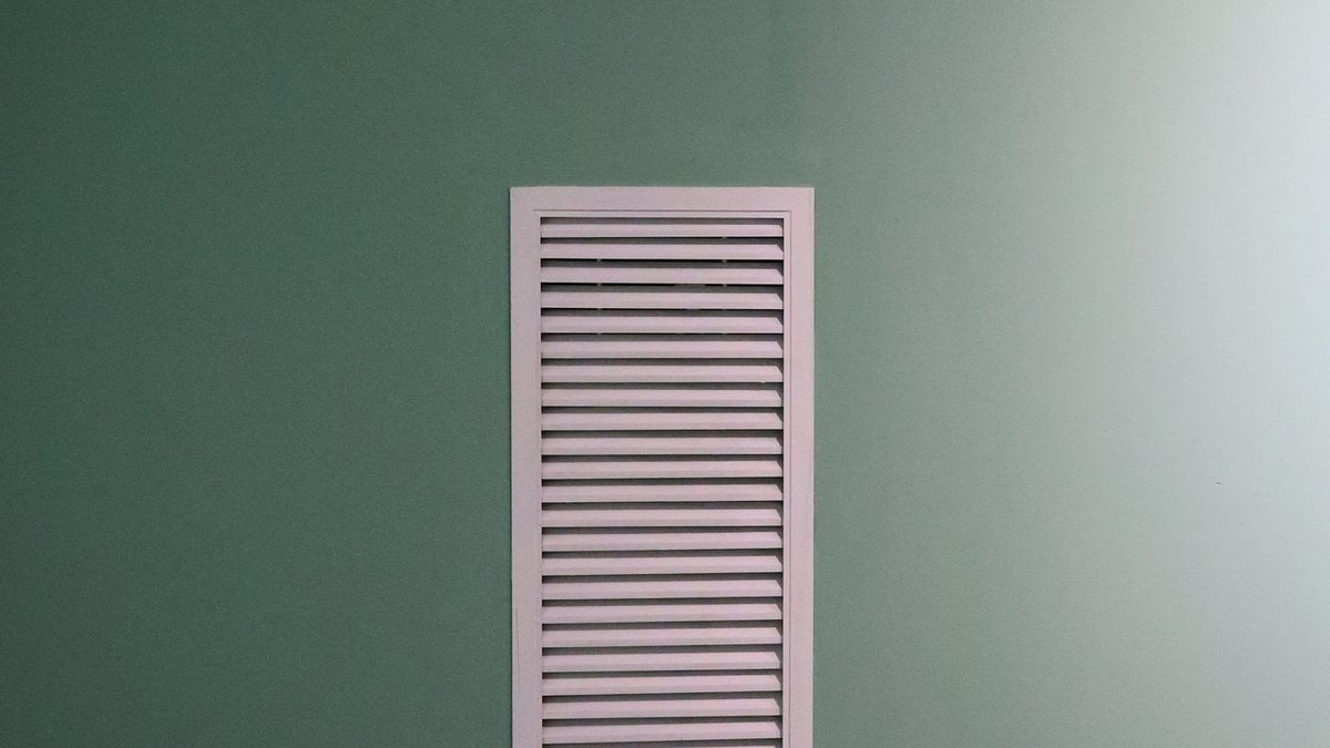 A return air vent grille set into a wall
